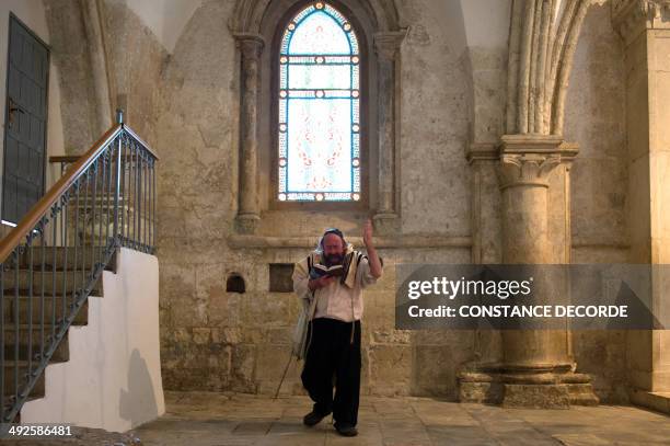 Jewish man recites the Psalm of David inside to the Cenacle or Upper Room on Mount Zion just outside the Old City of Jerusalem, on May 21, 2014. For...