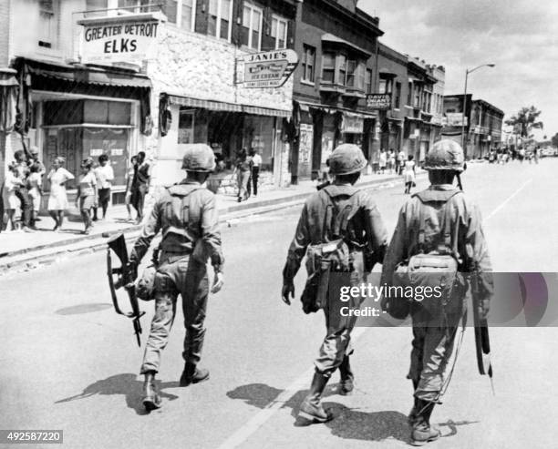 Federal soldiers patrol in a Detroit street on July 27, 1967 during riots that erupted in Detroit following a police operation.