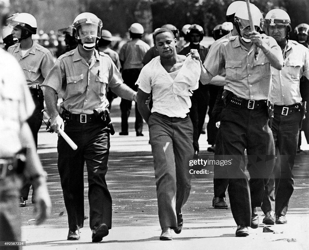 Detroit Riot Boy Policemen arrest a black suspect in a Detroit street on July 25, 1967 ...