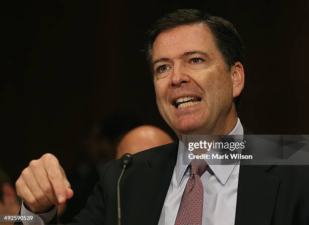 Director James Comey testifies during a Senate Judiciary Committee hearing on Capitol Hill, May 21, 2014 in Washington, DC. The committee is hearing...