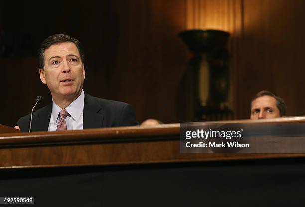 Director James Comey testifies during a Senate Judiciary Committee hearing on Capitol Hill May 21, 2014 in Washington, DC. The committee is hearing...