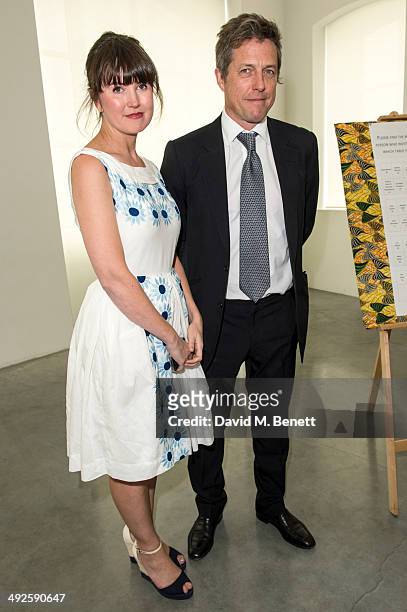Gabby Deeming,Hugh Grant attend the ASAP: African Solutions to African Problems private lunch at the Louise T Blouin Foundation on May 21, 2014 in...