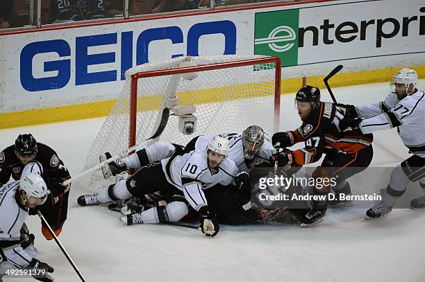 Nick Bonino of the Anaheim Ducks falls as Mike Richards and Jonathan Quick of the Los Angeles Kings defend the goal in Game Seven of the Second Round...