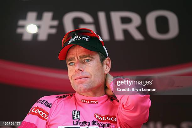 Race leader and wearer of the maglia rosa Cadel Evans of Australia and BMC Racing Team celebrates on the podium after the eleventh stage of the 2014...