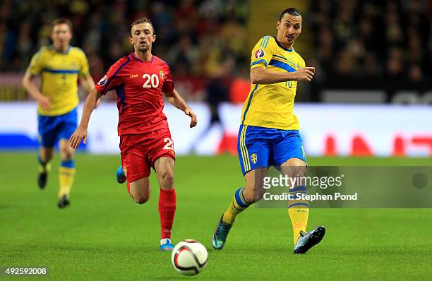Zlatan Ibrahimovic of Sweden and Alexandru Vremea of Moldova compete for the ball during the UEFA EURO 2016 Qualifying match between Sweden and...