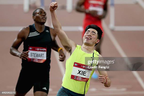 Chinese hurdler Xie Wenjun celebrates winning the men's 110-meter hurdles during 2014 IAAF World Challenge Beijing at National Stadium on May 21,...