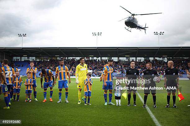 Helicopter from RAF Shawbury departs after delivering the match ball to celebrate Armed Forces Day at the Sky Bet League One match between Shrewsbury...