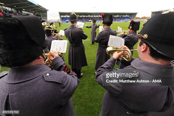 The Royal Signals Band play at half time to celebrate Armed Forces Day during the Sky Bet League One match between Shrewsbury Town and Colchester...