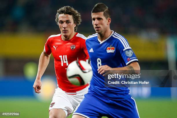 Julian Baumgartlinger of Austria competes for the ball with Sandro Wieser of Liechtenstein during the UEFA EURO 2016 Qualifier between Austria and...