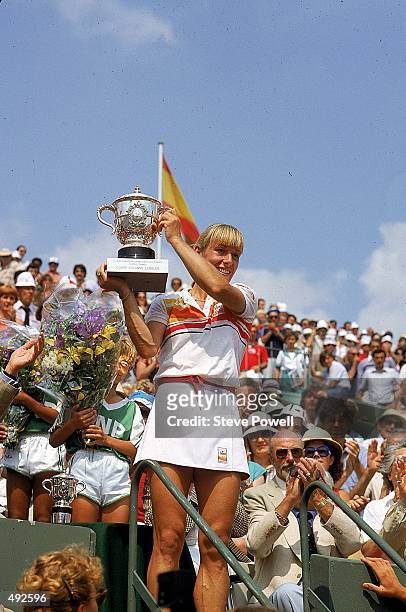 Martina Navratilova of the USA lifts the trophy after defeating Andrea Jaeger of the USA in the Women's Singles Final of the French Open Tennis...