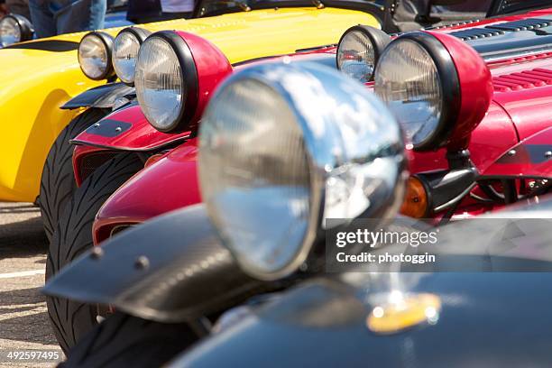 parked sports cars - lotus merknaam stockfoto's en -beelden