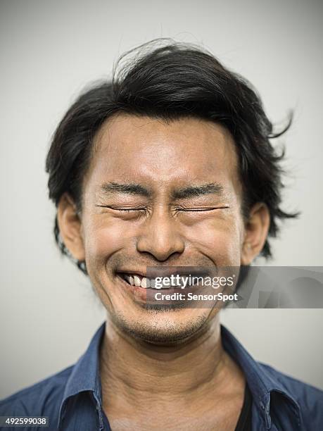 portrait of a young japanese man looking at camera - ecstatic face stock pictures, royalty-free photos & images