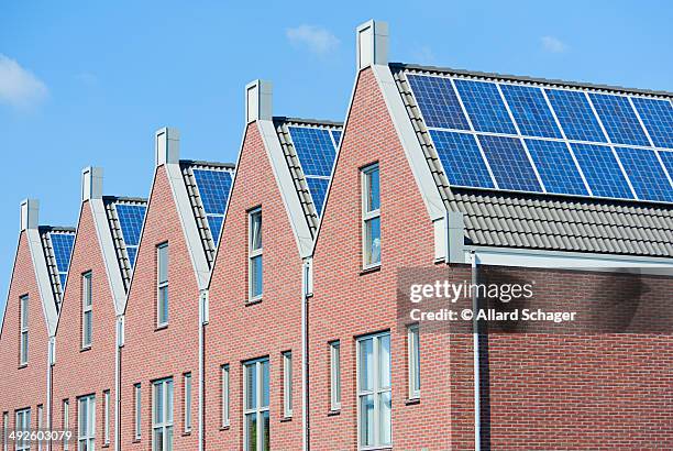 modern dutch houses with solar panels on roof - heerhugowaard stock pictures, royalty-free photos & images