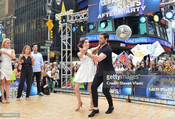 Dancing With The Stars" Season 18 winners Meryl Davis and Maksim Chmerkovskiy perform at ABC's "Good Morning America" at Times Square on May 21, 2014...