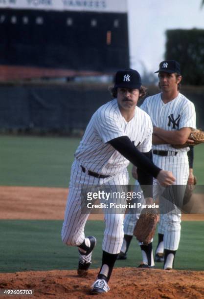 Catfish Hunter of the New York Yankees warms-up during spring training in March, 1975 in Tampa, Florida.