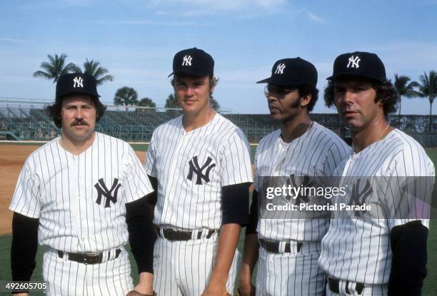 Catfish Hunter, Doc Medich, Rudy May and Pat Dobson of the New York Yankees pose for a portrait during spring training in March, 1975 in Tampa,...