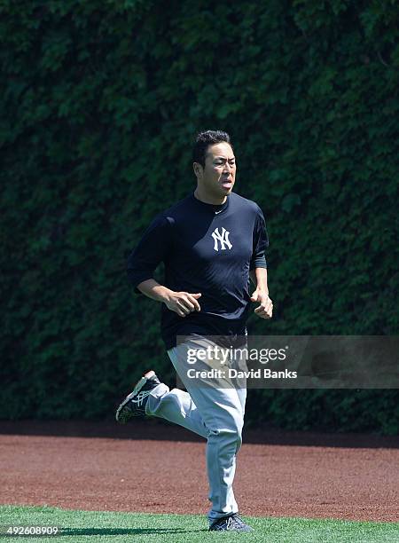 Hiroki Kuroda of the New York Yankees warms up before the game against the Chicago Cubs on May 21, 2014 at Wrigley Field in Chicago, Illinois.