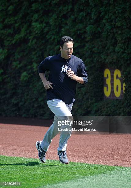 Hiroki Kuroda of the New York Yankees warms up before the game against the Chicago Cubs on May 21, 2014 at Wrigley Field in Chicago, Illinois.