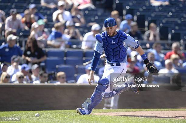 Catcher Brett Hayes of the Kansas City Royals fields his position as he runs to retrieve a wild pitch in the game against the Detroit Tigers on May...