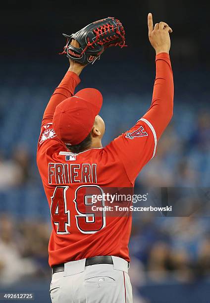 Ernesto Frieri of the Los Angeles Angels of Anaheim celebrates his save and the team's victory during MLB game action against the Toronto Blue Jays...