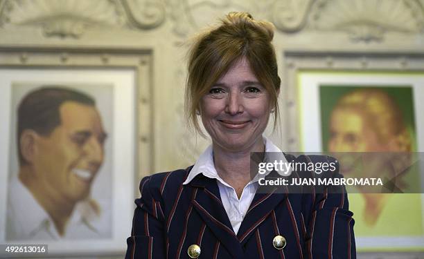 Buenos Aires Government Minister Cristina Alvarez Rodriguez smiles next to portraits of her grand-aunt, Argentine former First Lady Eva Peron , and...