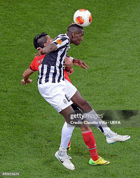 Paul Pogba of Juventus wins a header against Enzo Pérez of Benfica during the UEFA Europa League semi final match between Juventus and SL Benfica at...