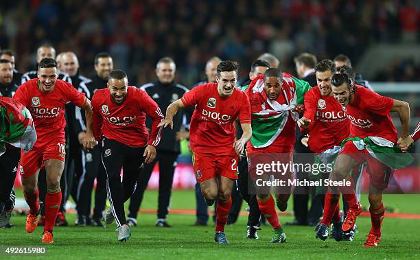 Gareth Bale and Aaron Ramsey , Ashley Williams and Chris Gunter of Wales celebrate victory and qualification after the UEFA EURO 2016 qualifying...