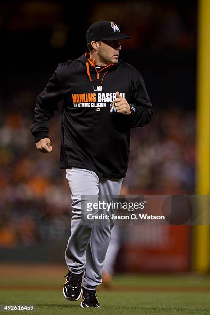 Mike Redmond of the Miami Marlins returns to the dugout after arguing a call against the San Francisco Giants during the fourth inning at AT&T Park...