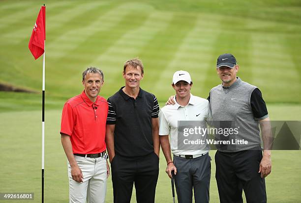 Rory McIlroy of Northern Ireland poses with former footballers Phil Neville , Teddy Sheringham and Peter Schmeichel during the Pro-Am ahead of the...