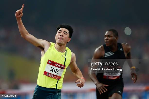 Xie Wenjun of China celebrates winning the men's 110-meter hurdles during 2014 IAAF World Challenge Beijing at National Stadium on May 21, 2014 in...