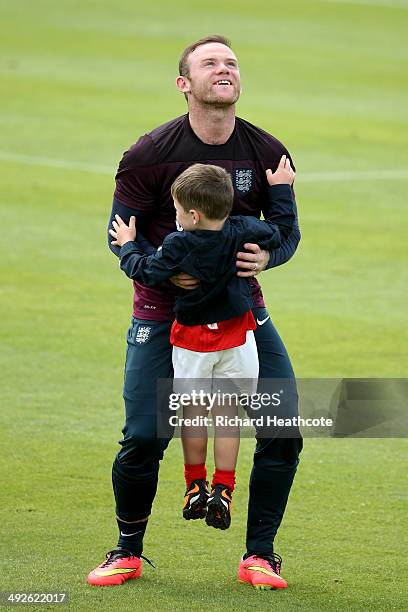 Wayne Rooney hugs his son Kai at the end of a training session at the England pre-World Cup Training Camp at the Vale Do Lobo Resort on May 21, 2014...