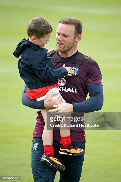 Wayne Rooney hugs his son Kai at the end of a training session at the England pre-World Cup Training Camp at the Vale Do Lobo Resort on May 21, 2014...