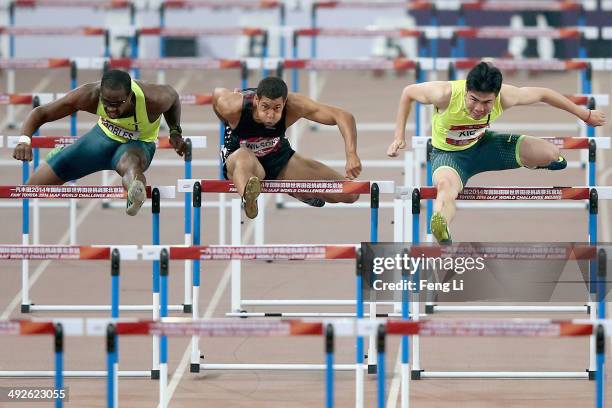 Chinese hurdler Xie Wenjun , Ryan Wilson and Dayron Robles of United States complete during the Men's 110-meter hurdles of 2014 IAAF World Challenge...