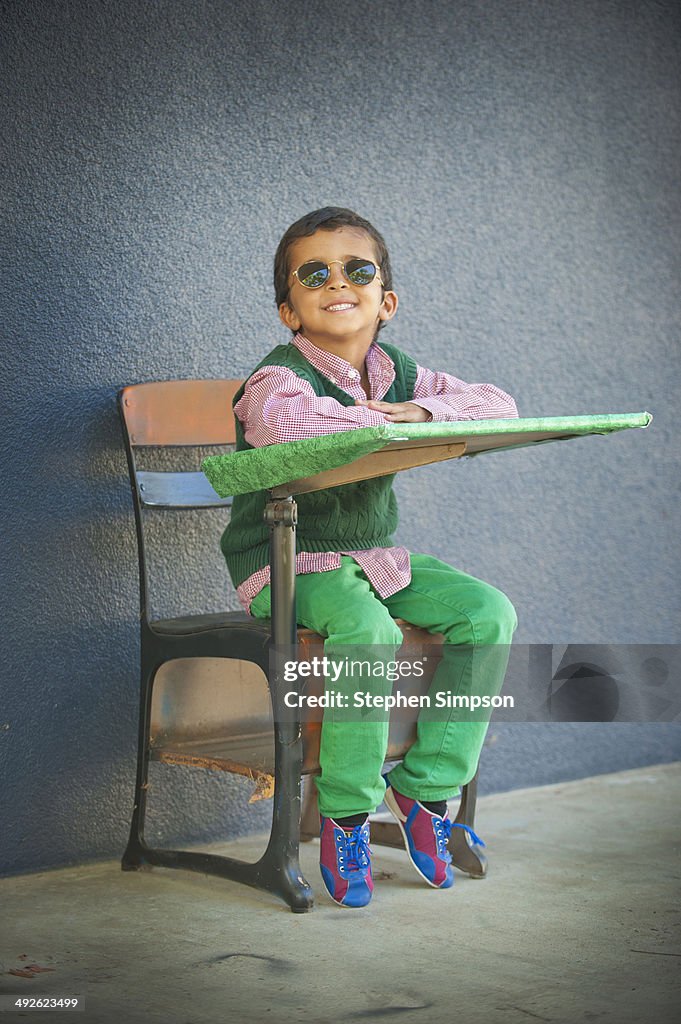 Colorful personality boy at his desk