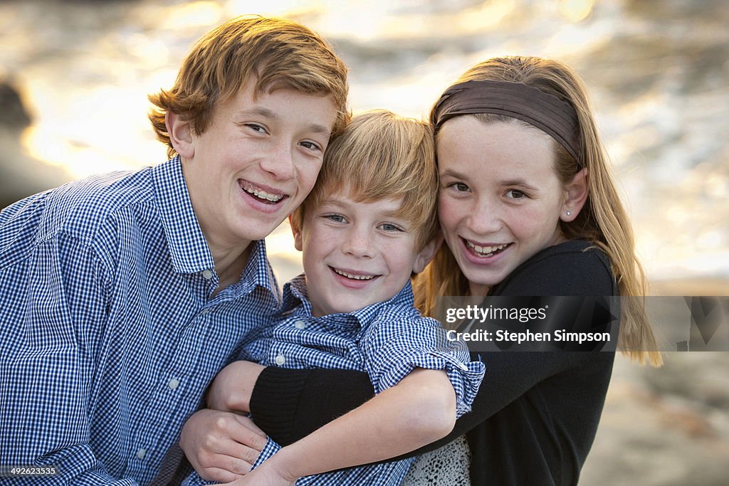 Outdoor portrait, three siblings