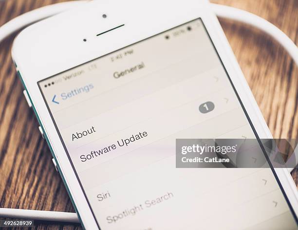 technology: iphone5 showing software update - concept updates stock pictures, royalty-free photos & images