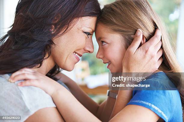 the love of a mother and daughter - forehead stock pictures, royalty-free photos & images