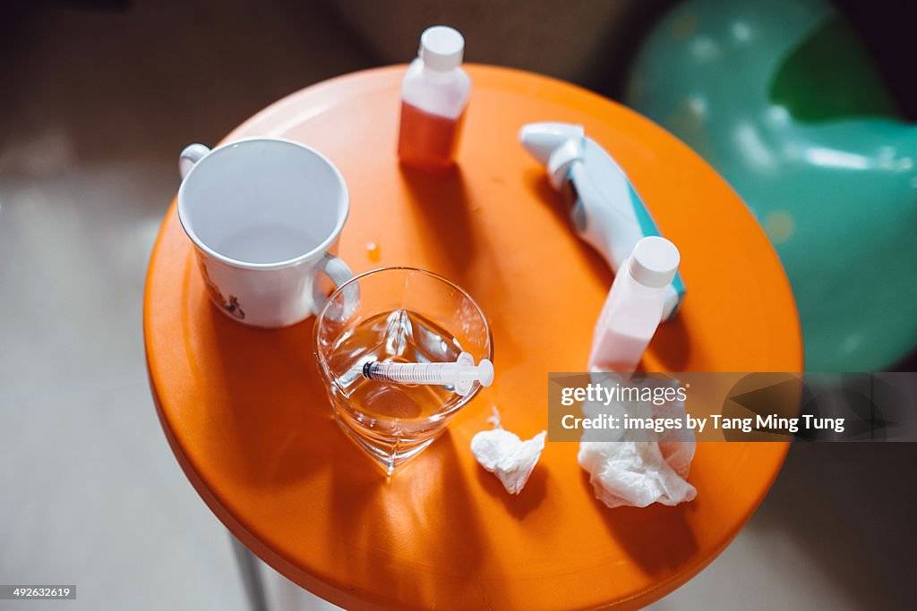 Liquid medicine, plastic syringe & ear thermometer