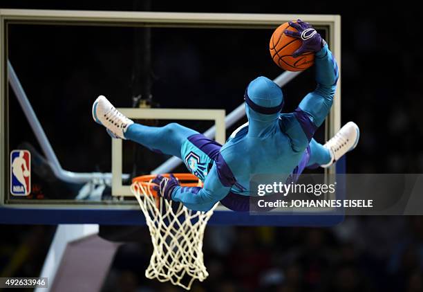 Man in a costume makes a stunt with a basketball before the 2015 NBA Global Games China pre-season basketball match, the Los Angeles Clippers vs...