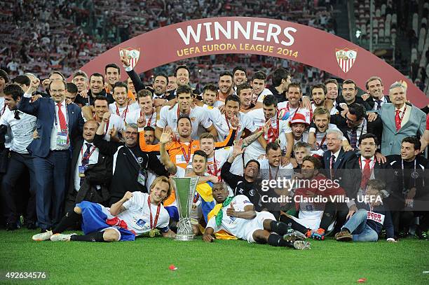 Sevilla players celebrate victory with the trophy after the UEFA Europa League Final Between Sevilla FC and SL Benfica at Juventus Arena on May 14,...