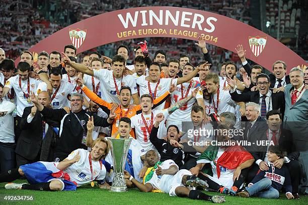 Sevilla players celebrate victory with the trophy after the UEFA Europa League Final Between Sevilla FC and SL Benfica at Juventus Arena on May 14,...