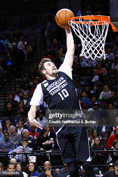 Sergey Karasev of the Brooklyn Nets dunks the ball during the Open Practice on October 11, 2015 at Barclays Center in Brooklyn, NY. NOTE TO USER:...