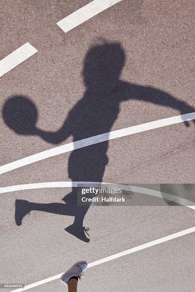 Shadow of man Playing basketball