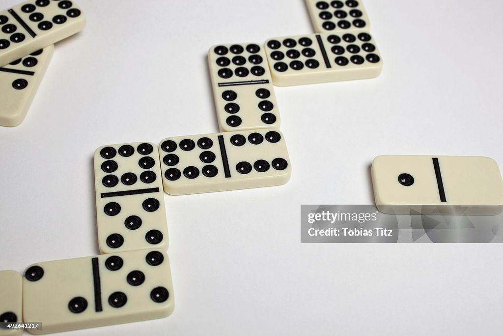 Dominoes on white background, close-up