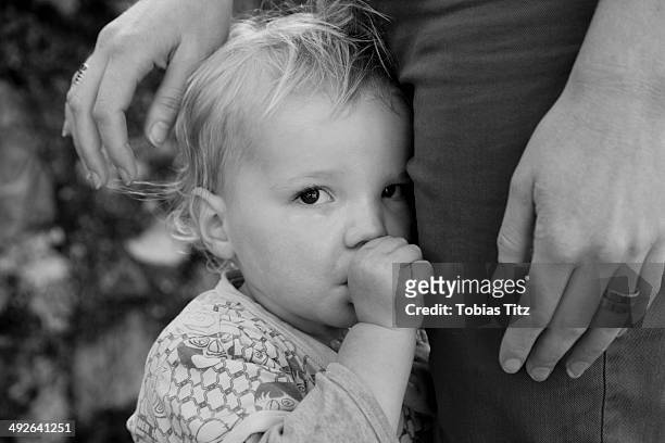 baby boy with mother, looking at camera - no confidence stock pictures, royalty-free photos & images