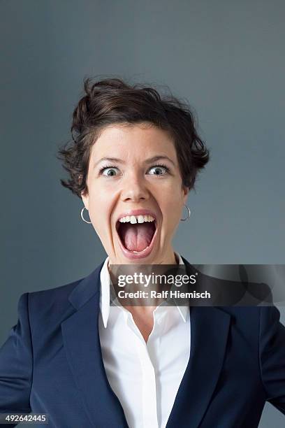 portrait of mid adult woman with open mouth, close-up - mouth open stock-fotos und bilder