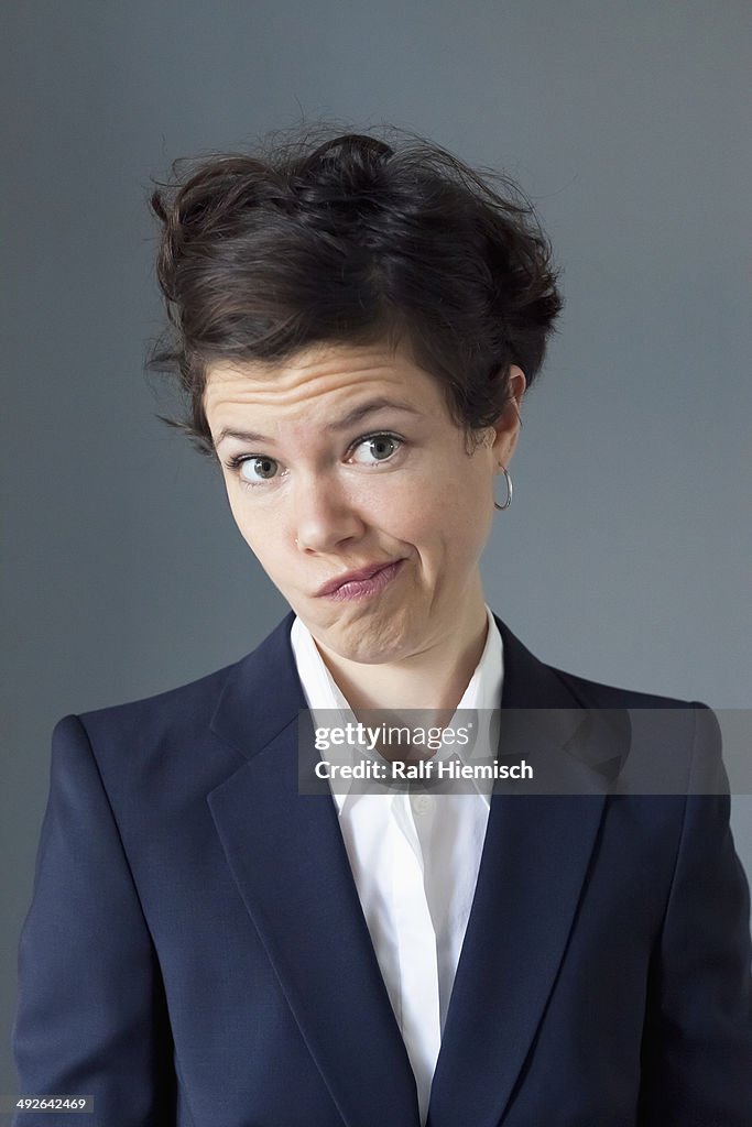 Portrait of mid adult woman making funny face, close-up