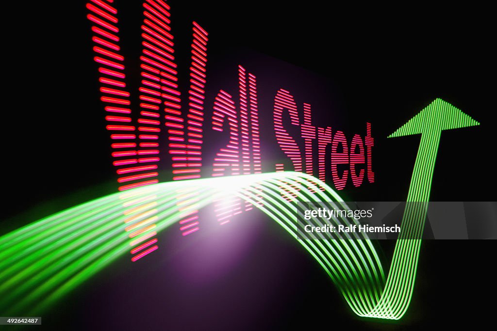 Up arrow sign and text 'Wall Street' with light effect