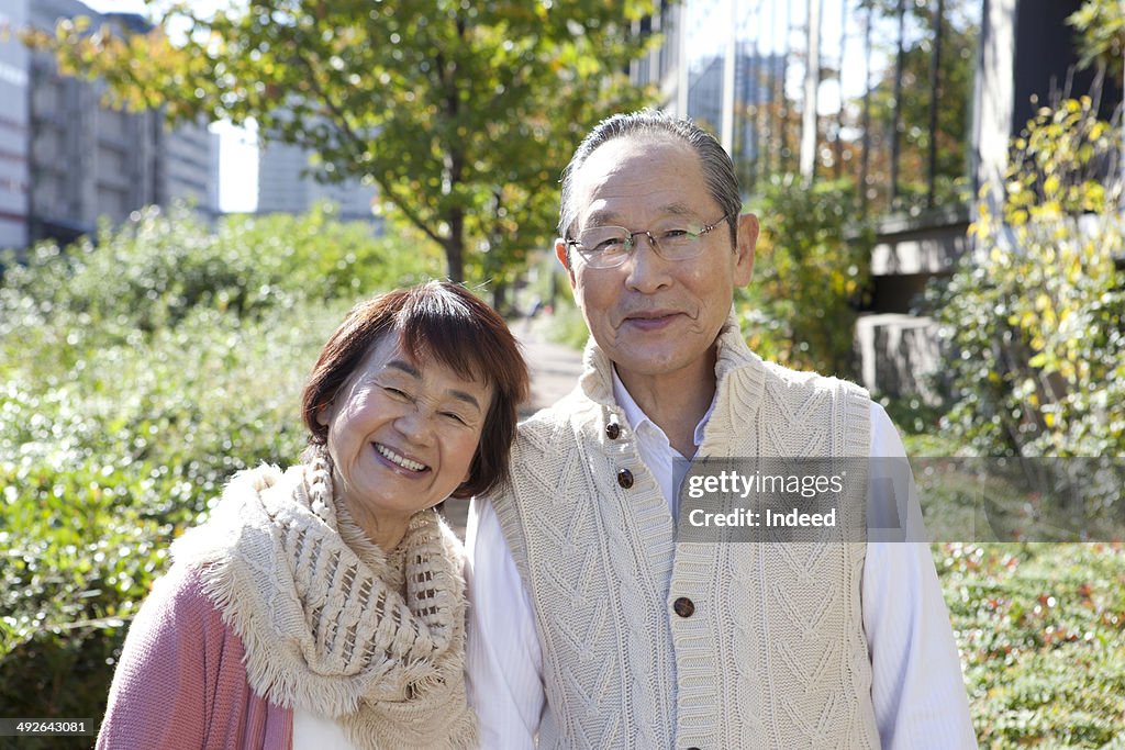 Portrait of Japanese senior couple on street