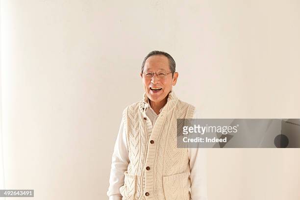 smiling senior man - japanese old man foto e immagini stock
